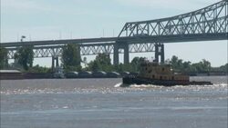 A boat motors up The Mississippi River. Stock Footage