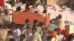 Robed men carry a litter in which little girls and boys ride during Diwali. Stock Footage