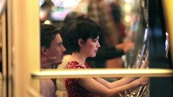 Hopeful young woman cranks slot machine and hits jackpot, jumps up and celebrates with friends Stock Footage