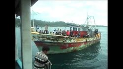 4:3 Boat carrying alleged asylum seekers towed to shore by fishermen Instructional Video