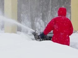 Man pushing snow blower Stock Footage