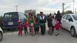 CLEAN : Clowns bring light relief to migrant children at Greek camp News Clip