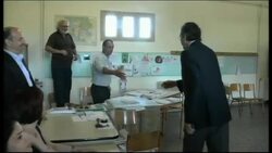 +4:3 Greek party leaders cast votes, Karamanlis at polling station Instructional Video