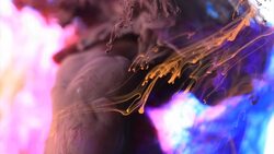 Black ink tornado and orange drops Stock Footage