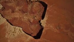 High altitude flying tilt camera to reveal canyon at Cannyonlands National Park Utah Stock Footage
