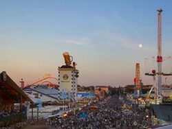 WS T/L ZI Shot of people enjoying at Oktoberfest and full moon from dusk to night / Munich, Bavaria, Germany Stock Footage
