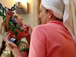 MS Mother putting make up on her daughter who is all dressed up in costume / Lamy, New Mexico, United States Stock Footage