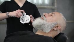 brutal barber clipper mows bearded adult senior hipster Stock Footage