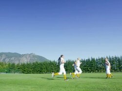 MS Group of female softball teammates running drills in field before game Stock Footage