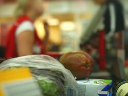 HD Cashier scanning groceries at checkout counter Stock Footage