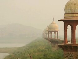 MS View of  chhatris at lakeside / Alwar, Rajasthan, India Stock Footage