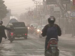 Water poured onto streets of Yogjakarta after Merapi volcano erupts ash over the city; Central Java, Indonesia. 30 October 2010 / AUDIO Stock Footage