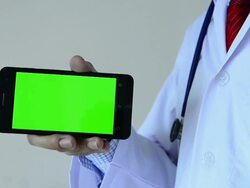 Doctor with green screen mobile device Stock Footage