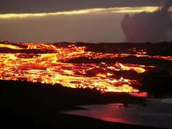 WS T/L Molten lava river falling into ocean at dawn / Kalapana, Hawaii, USA Stock Footage
