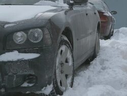 MS Car pulling out of driveway in snow Stock Footage