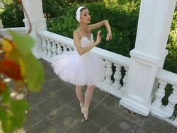 dancer dressed as a swan in a beautiful park Stock Footage
