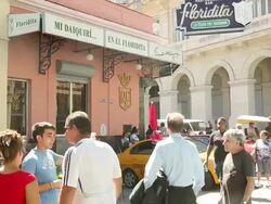 MS Shot of Floridita exterior and Hemingway bar with Pedestrians / Havana, Cuba  Stock Footage
