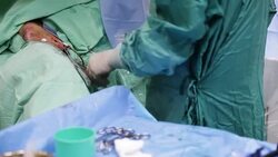 Doctor injects operated patient in operating room Stock Footage