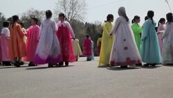 North Korean women wear traditional costumes as they dance in celebration of the 100th anniversary of the birth of President Kim Jong Il, April 15th 2012. Stock Footage
