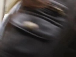 two women walking by the camera and turning to look at the camera as they pass by Stock Footage