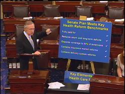 Harry Reid, the Senate majority leader, says the health care reform bill reduces short-term and long-term debt, expands coverage, contains reform and promotes competition. News Clip