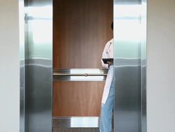 MS Young physician exiting elevator / Seattle, Washington, USA Stock Footage