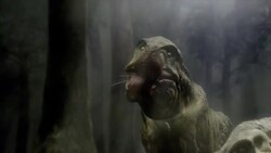 A Tyrannosaurus Rex chews its prey in a forest in a computer-generated animation. Stock Footage