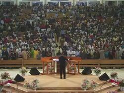 WS View of large church interior filling up with people praying, singing and dancing / Lagos, Nigeria Stock Footage