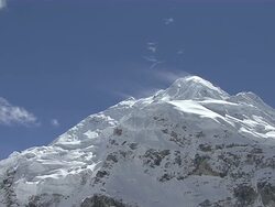 MS Snow blowing with wind on snow covered peak of mount everest with blue sky / Mt. Everest, Nepal Stock Footage