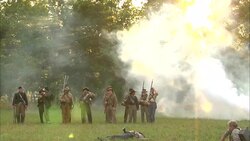 Smoke surrounds a small band of Confederate soldiers on a Civil War battlefield. Stock Footage