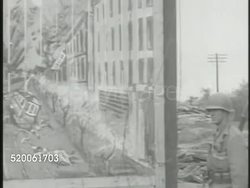 1950: KOREAN WAR: PYONGYANG: VS Republic of Korea (ROK) & United States Marines advancing into North Korea capital city Pyongyang, soldiers walking past deceased body on street (NOT GRAPHIC). 38th Parallel, Korea Instructional Video