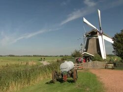 Dutch windmill in meadow, the Netherlands Stock Footage