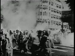 A young man is injured during a demonstration against South Vietnamese Premier Ngo Dinh Diem by Buddhist monks. News Clip