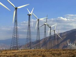 WS T/L Wind turbines in field with mountains in background, North Palm Springs, California, USA Stock Footage