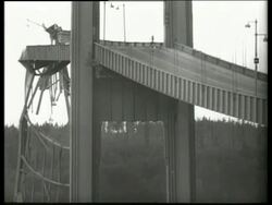 B/W 1940's low angle of collapsed bridge / Tacoma Narrows Bridge / SOUND Stock Footage