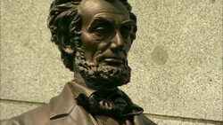 Statue of Abraham Lincoln holding scroll with the inscribed word Emancipation Stock Footage