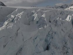 Aerial of Norwegian mounatins and glacier in winter. Stock Footage