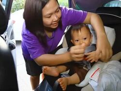 HD:Mother take off her baby from seat belt. Stock Footage