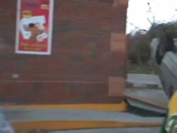 MS PAN Shot of damaged store and upside down car moments after tornado / Woodward, Iowa, United States Stock Footage