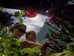 A mother and daughter picking out plants and flowers for their garden on a sunny day. Stock Footage