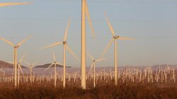 part of the Tehachapi Pass wind farm, the first large scale wind farm area developed in the US, California, USA, at sunrise. Stock Footage
