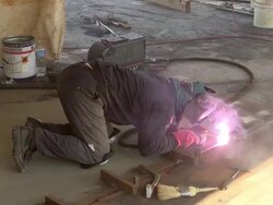 MS Shot of welder at bridge construction / Wellen, river Moselle, Germany Stock Footage