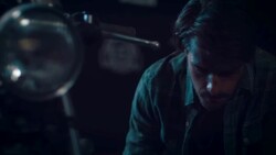 Man in motorcycle workshop building a bike Stock Footage