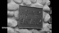1950: HIGH VIEW SANITARIUM: EXT High View Sanitarium gates. CU Sign on wall. Women working outside in garden.  Mental hospital, illness, sanitarium, asylum, social stigma, community gardening. Instructional Video