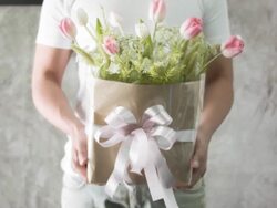 Man holding a bouquet tulips. Stock Footage