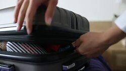 Woman packing for a trip Stock Footage