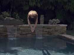 SLO MO WS TD Woman diving into swimming pool, splashing water/ California, USA Stock Footage