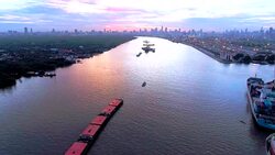 Silhouette cargo ship at dusk Stock Footage