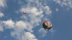 Colorful hot air balloon on blue sky Stock Footage
