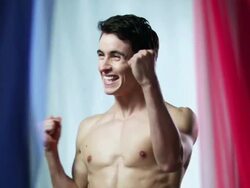 Man cheering with French flag in background Stock Footage
